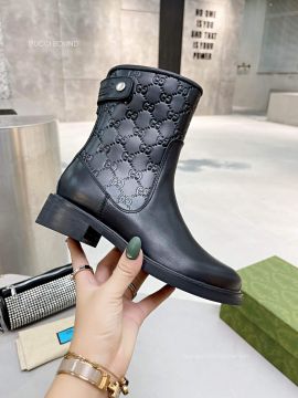 Gucci GG Embossed Leather Ankle Boot in Black 2281451